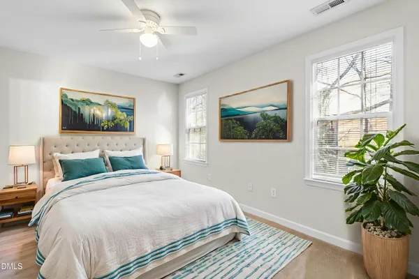 a bedroom with a large bed and a window