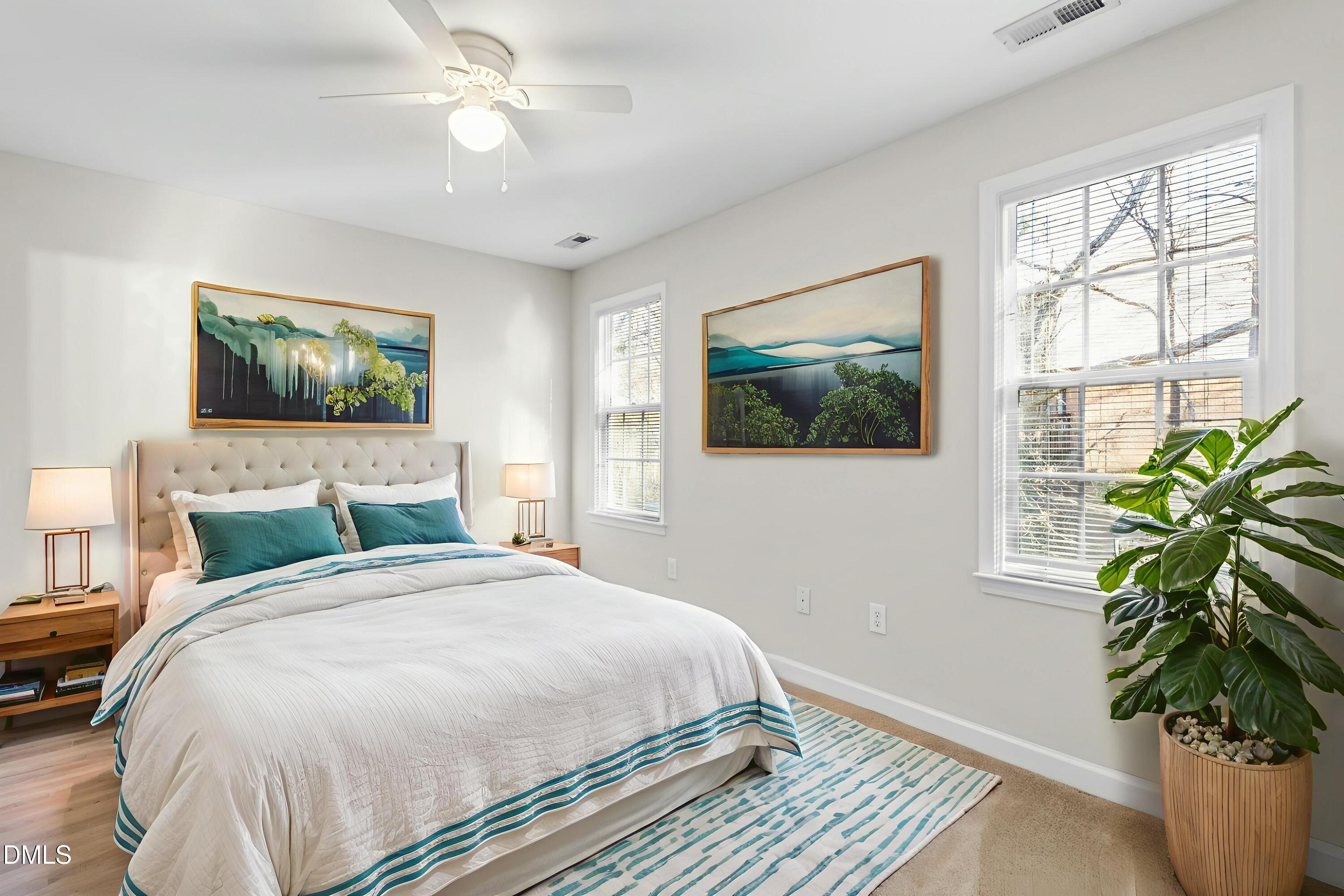 a bedroom with a large bed and a window