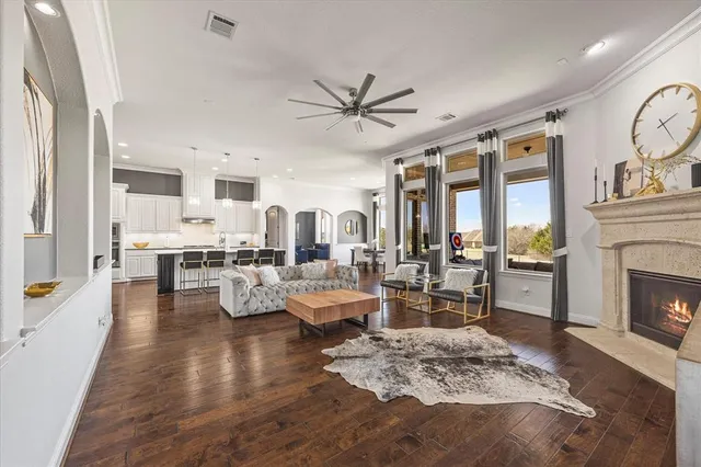 a living room with fireplace furniture and a fireplace