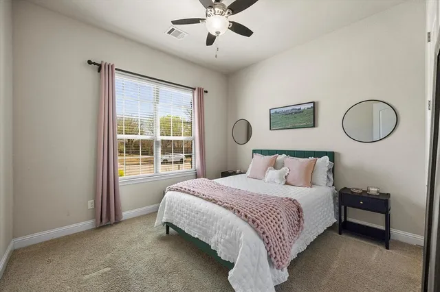 a bedroom with a bed and window