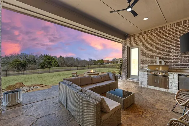 a balcony with furniture and a floor to ceiling window