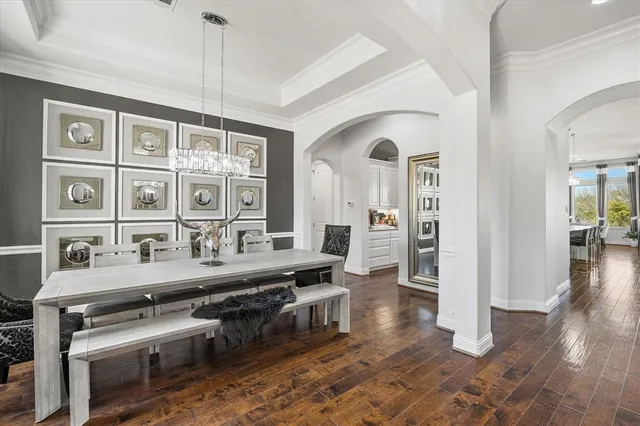 a very nice looking living room with wooden floor and furniture