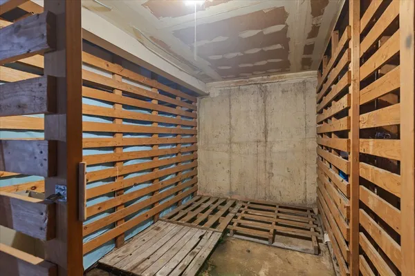 a view of a room with stairs and wooden floor