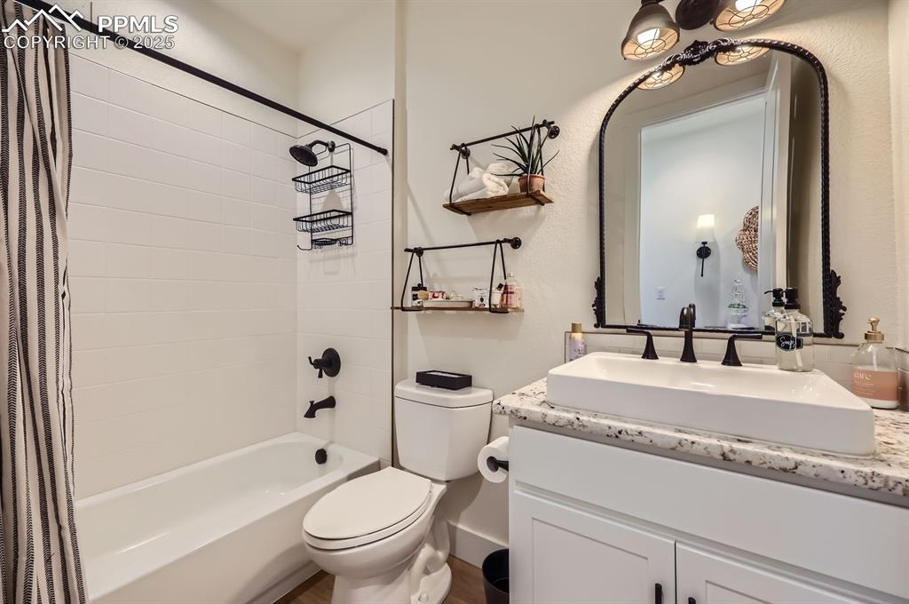 8735 Palomino Rdg View Peyton, CO 80831 - Photo 21 of 48 a bathroom with a granite countertop sink toilet and shower