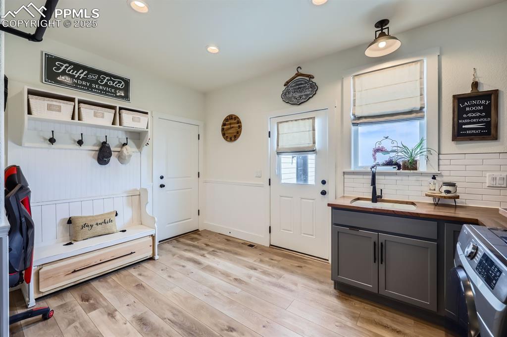 8735 Palomino Rdg View Peyton, CO 80831 - Photo 22 of 48 a kitchen with a sink and a stove top oven