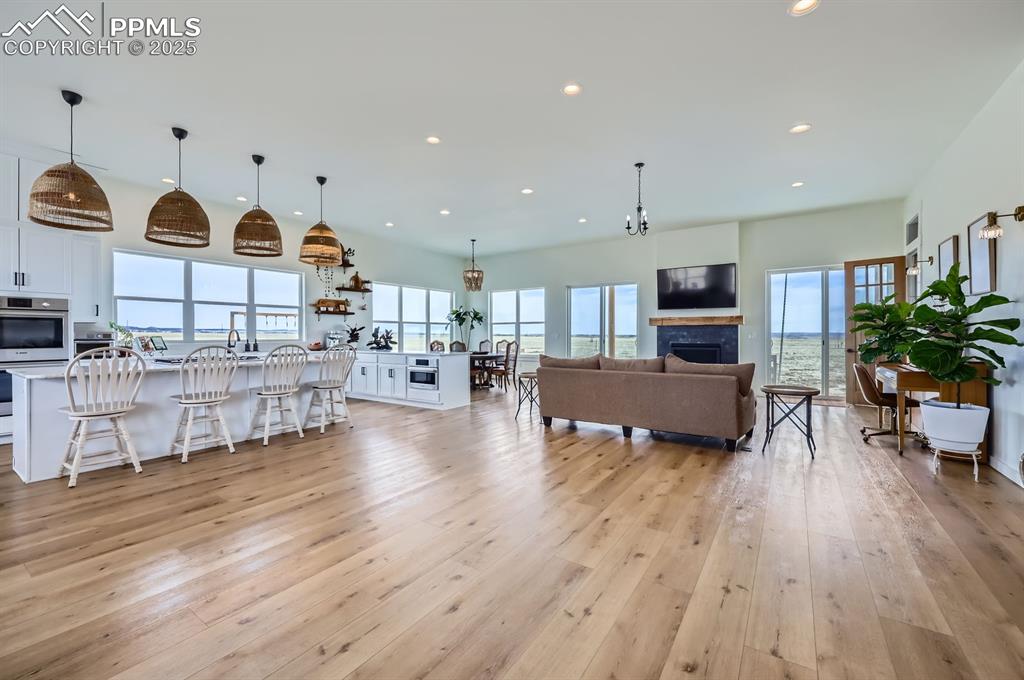 8735 Palomino Rdg View Peyton, CO 80831 - Photo 27 of 48 a living room with furniture and kitchen view