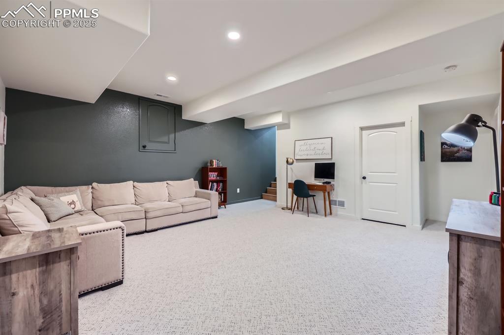 8735 Palomino Rdg View Peyton, CO 80831 - Photo 43 of 48 a living room with furniture and a table