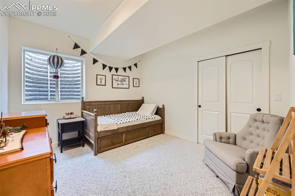 8735 Palomino Rdg View Peyton, CO 80831 - Photo 46 of 48 a bedroom with furniture and a couch