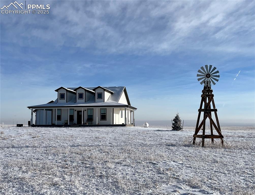 8735 Palomino Rdg View Peyton, CO 80831 - Photo 5 of 48 a view of a house with many windows