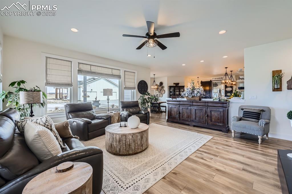 8735 Palomino Rdg View Peyton, CO 80831 - Photo 6 of 48 a living room with furniture kitchen view and a large window