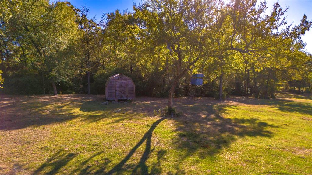 45 Interstate 45 Fairfield, TX 75840 - Photo 22 of 32 a view of swimming pool with large trees and wooden fence