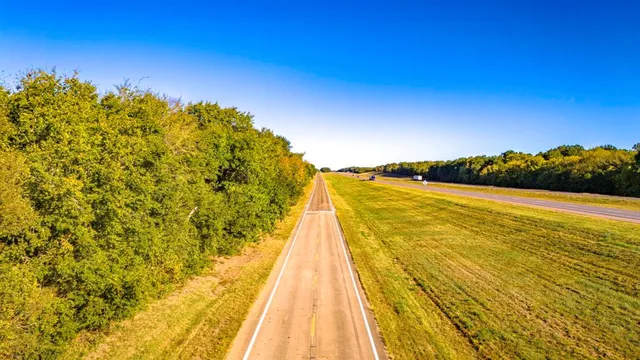 a view of swimming pool with an ocean from next to house