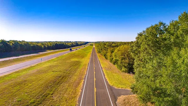 a view of swimming pool with seating area
