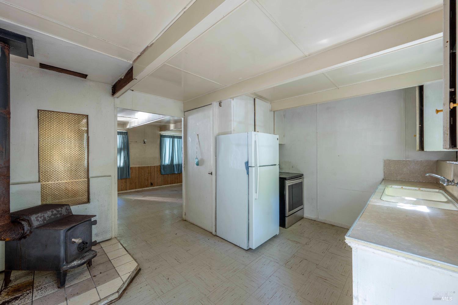 17390 Riverside Drive Guerneville, CA 95446 - Photo 5 of 20 a room with furniture and a storage