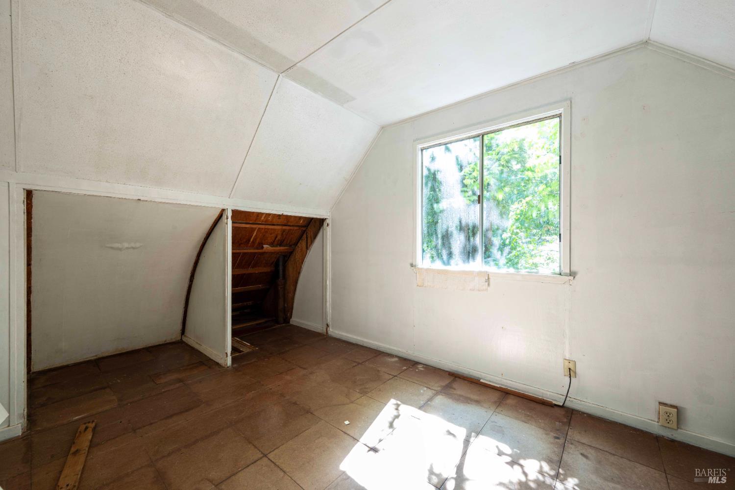 17390 Riverside Drive Guerneville, CA 95446 - Photo 10 of 20 an empty room with windows