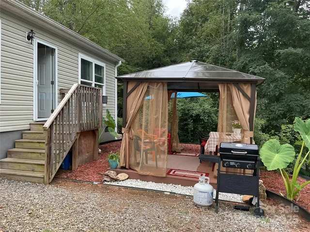 a view of a deck with a table and chairs