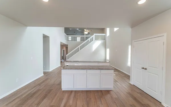 a view of an entryway with wooden floor