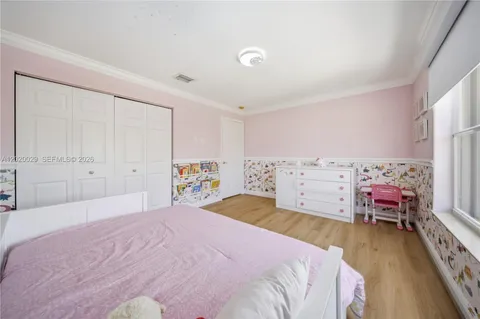 a bedroom with a bed and a closet