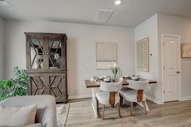 a workspace with wooden floor and a cabinet