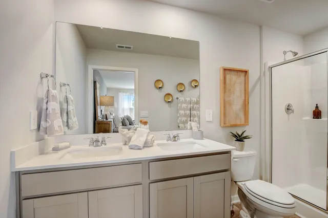 a bathroom with a sink a vanity and a mirror