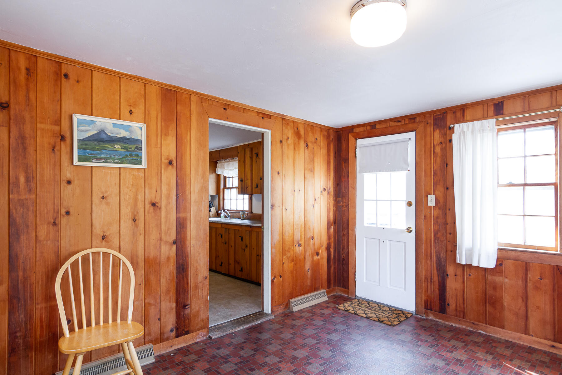 73 Santucket Road West Dennis, MA 02670 - Photo 17 of 36 a view of a hallway with wooden floor and windows