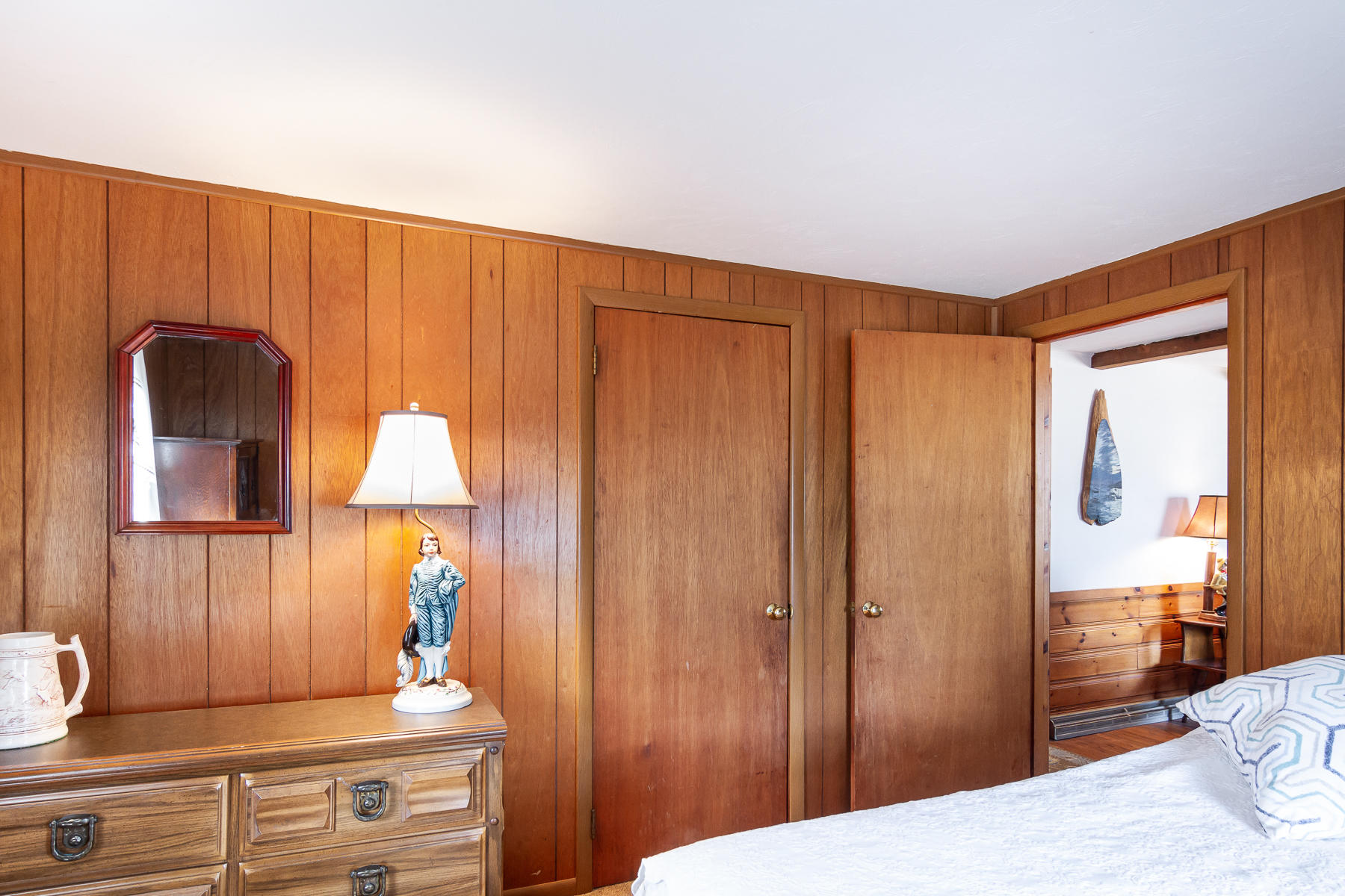 73 Santucket Road West Dennis, MA 02670 - Photo 24 of 36 a bedroom with a bed and a dresser