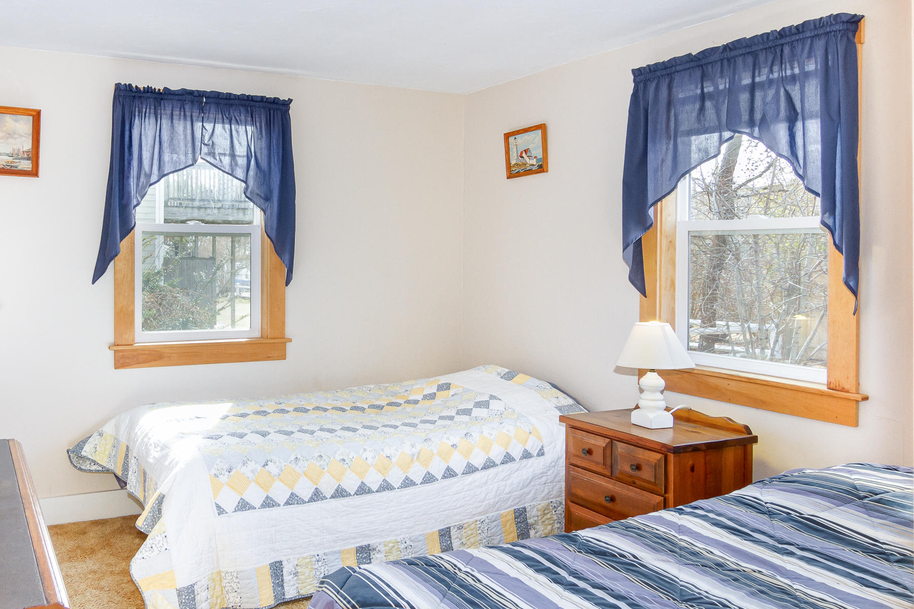 73 Santucket Road West Dennis, MA 02670 - Photo 25 of 36 a bedroom with a bed and wooden floor