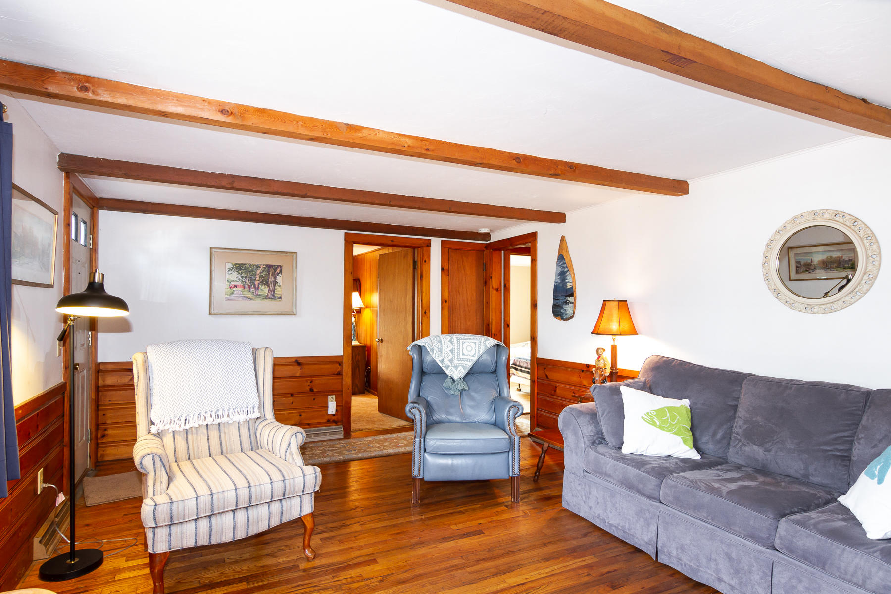 73 Santucket Road West Dennis, MA 02670 - Photo 7 of 36 a living room with furniture and a large window