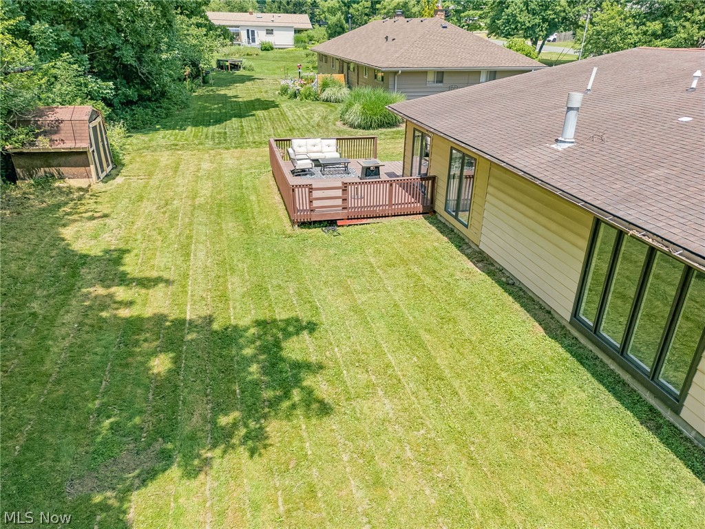8160 Joyce Road Broadview Heights, OH 44147 - Photo 34 of 45 Expansive green lawn featuring a wooden deck with dark railings