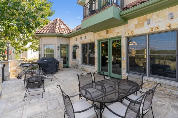 a patio with a table and chairs