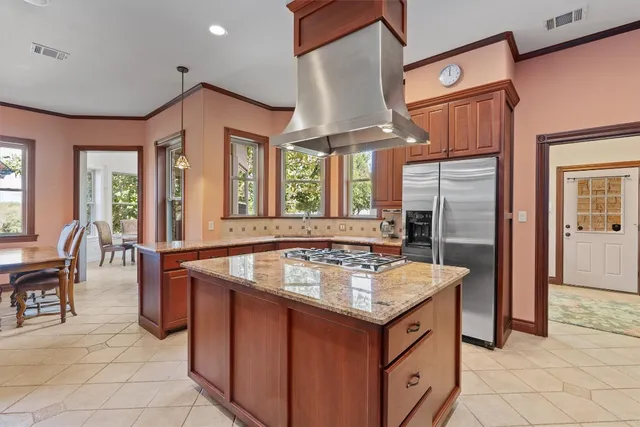 a kitchen that has a lot of cabinets in it