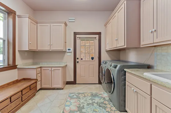 a kitchen with a sink and cabinets