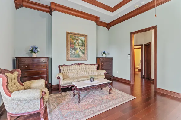a living room with furniture a rug and a window