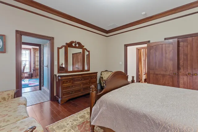 a bedroom with a bed and a dresser