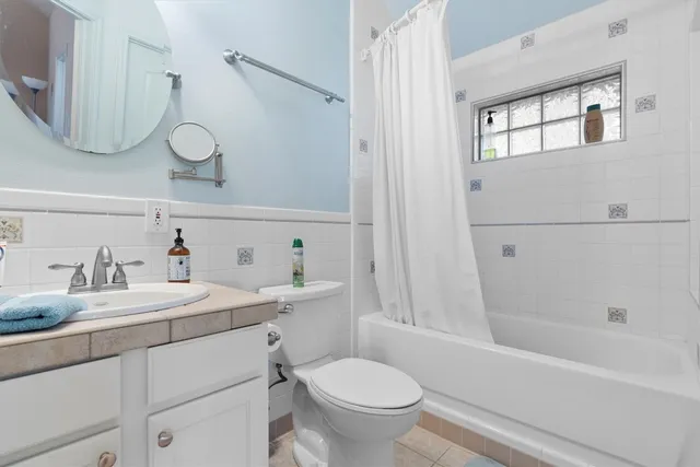 a bathroom with a sink a toilet and a bathtub