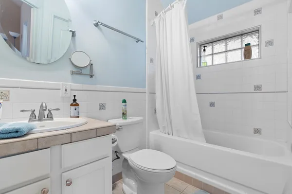 a bathroom with a sink a toilet and a bathtub