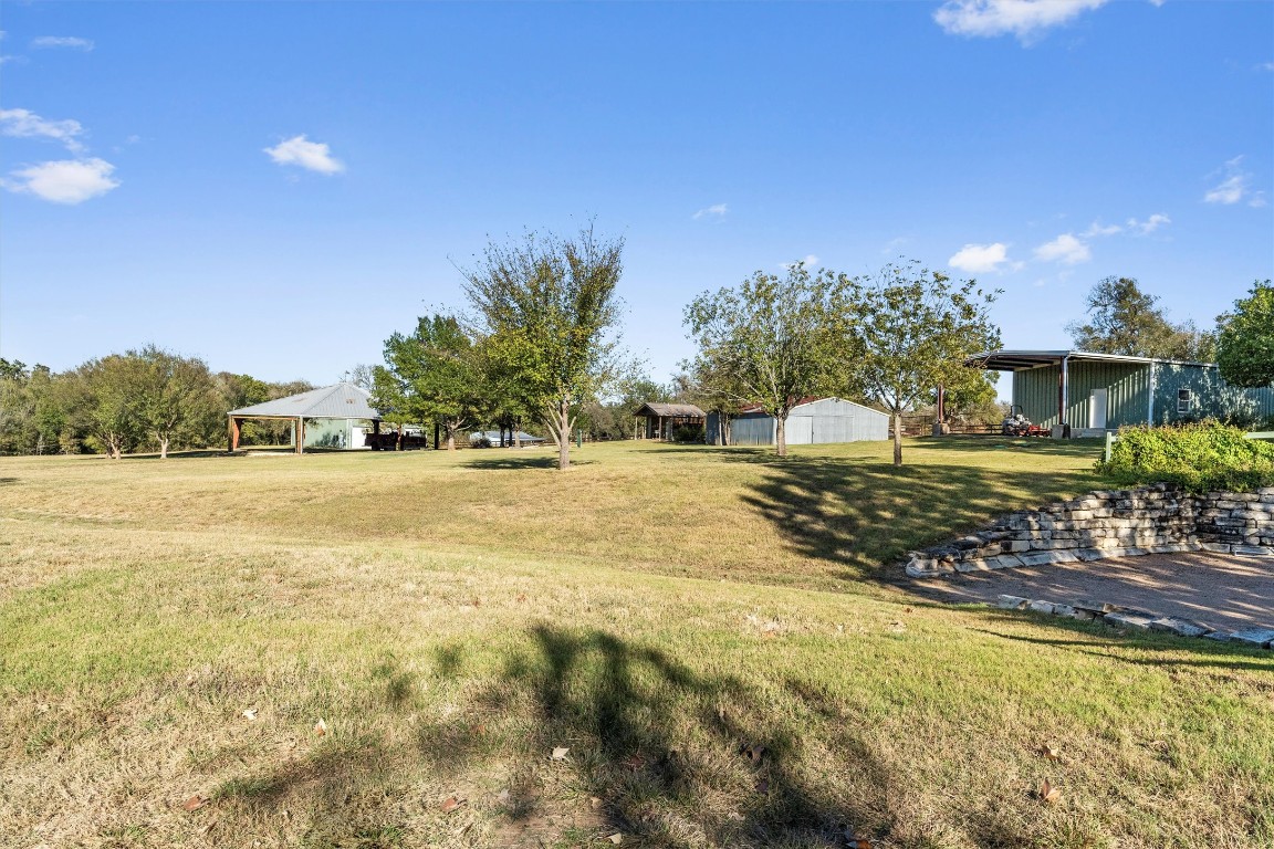 1092 Farm To Market Road 3000 Elgin, TX 78621 - Photo 35 of 40 a view of swimming pool with an outdoor space and seating area