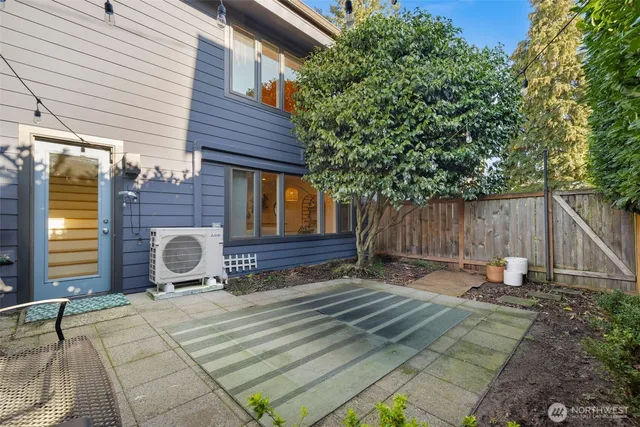 a backyard of a house with barbeque oven