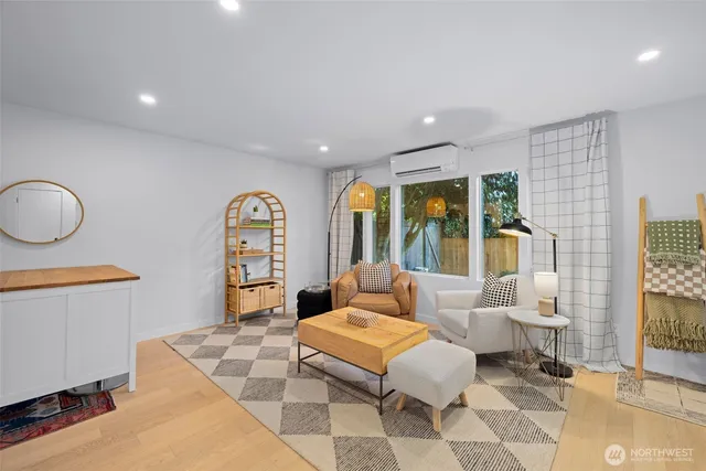 a living room with furniture and a large window