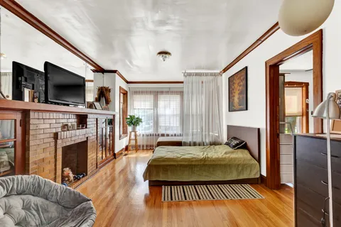 a living room with fireplace furniture and a flat screen tv