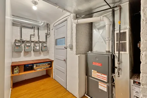 a view of a kitchen with a refrigerator and cabinets
