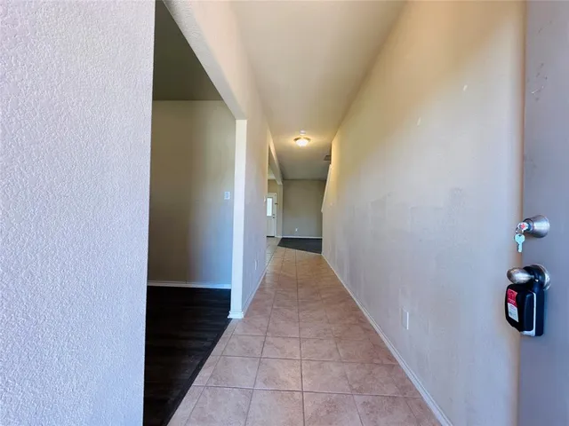 a view of a hallway with white walls