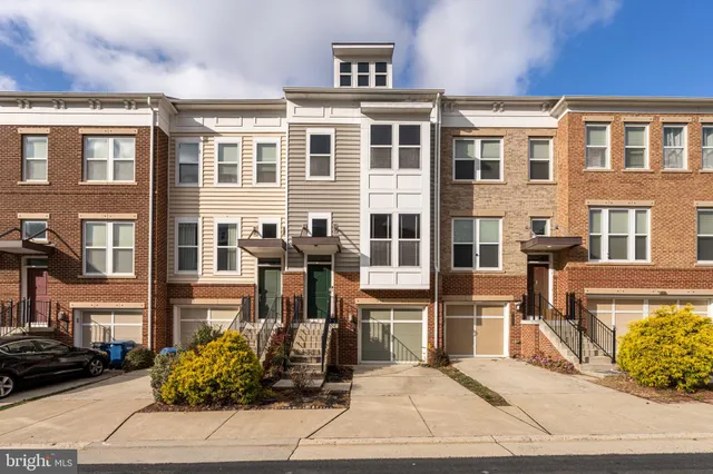 a front view of a building with garden
