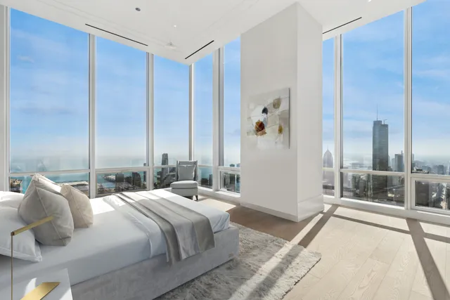 a bedroom with a bed and glass door