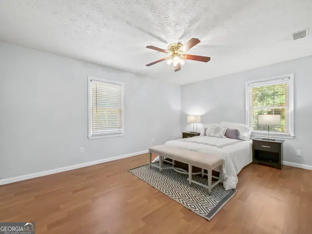 a bedroom with a bed and window