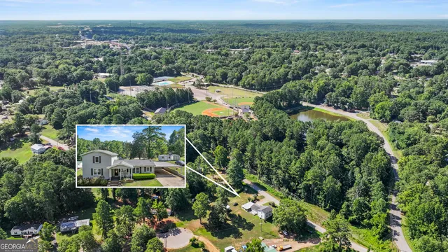 an aerial view of a house with a garden