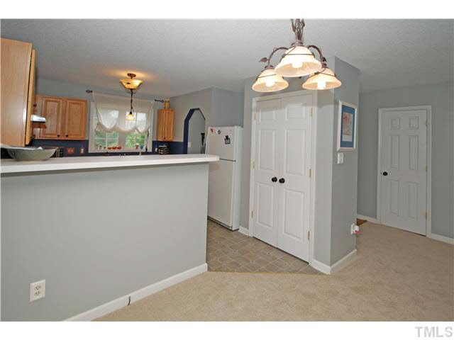 4712 Valley Stream Drive Raleigh, NC 27616 - Photo 12 of 25 a kitchen with cabinets and window