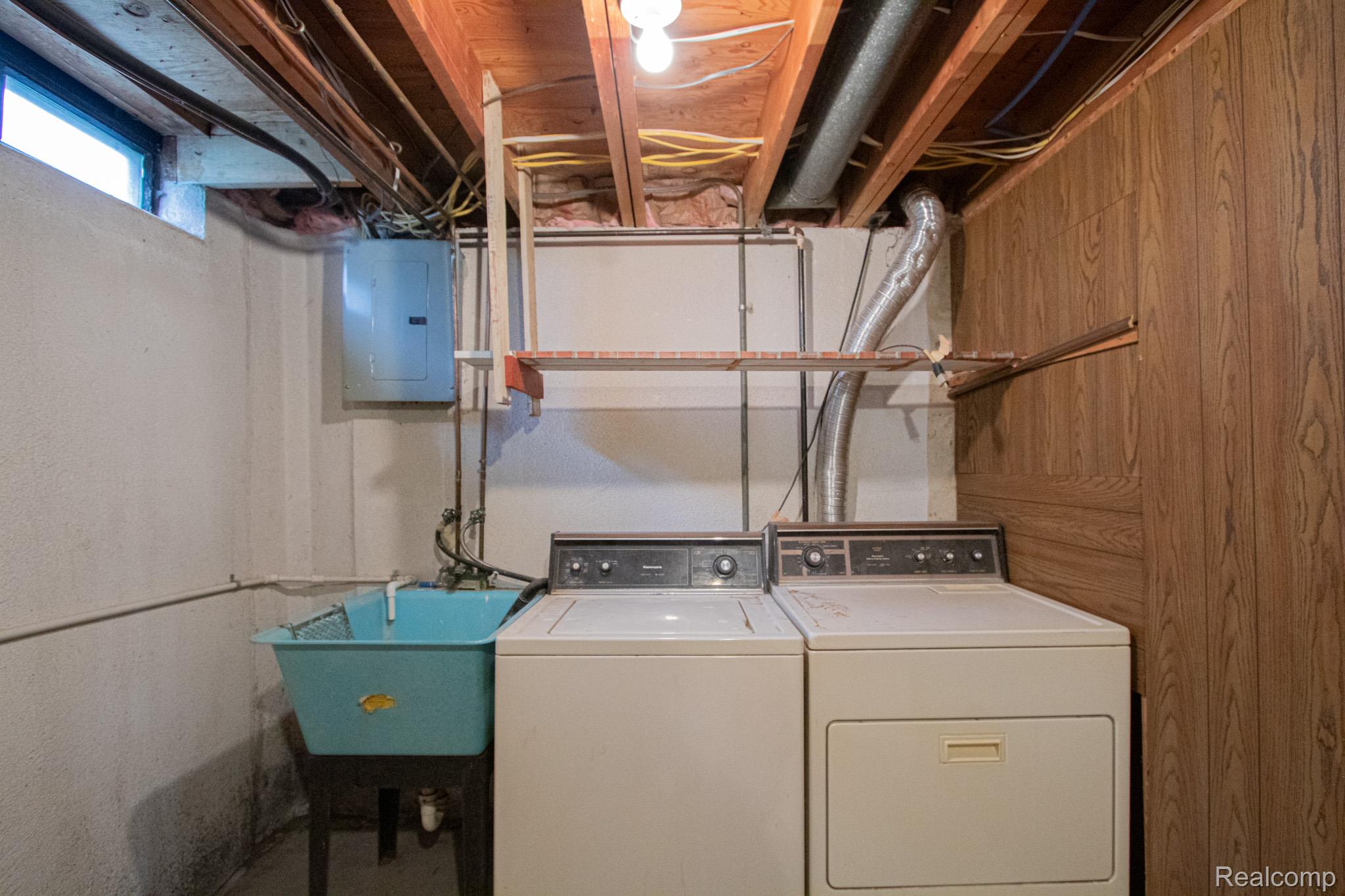 31000 Fall Fraser, MI 48026 - Photo 25 of 28 Laundry area with washer and clothes dryer, electric panel, and concrete flooring