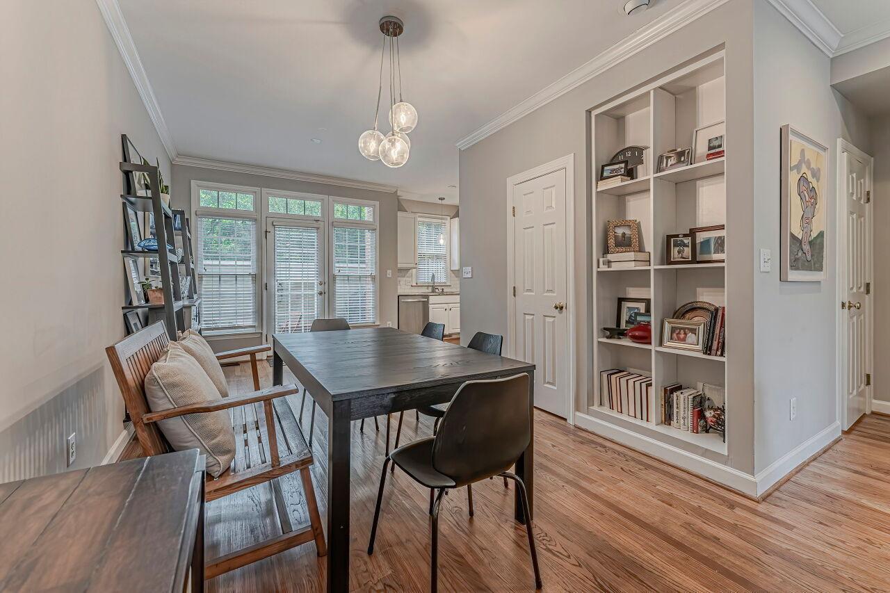 106 Hatfield Lane Raleigh, NC 27603 - Photo 8 of 29 a view of a dining room with furniture window and wooden floor