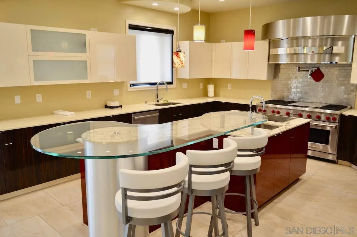 1235 Neptune Avenue Encinitas, CA 92024 - Photo 25 of 32 a kitchen with a stove a sink and a refrigerator